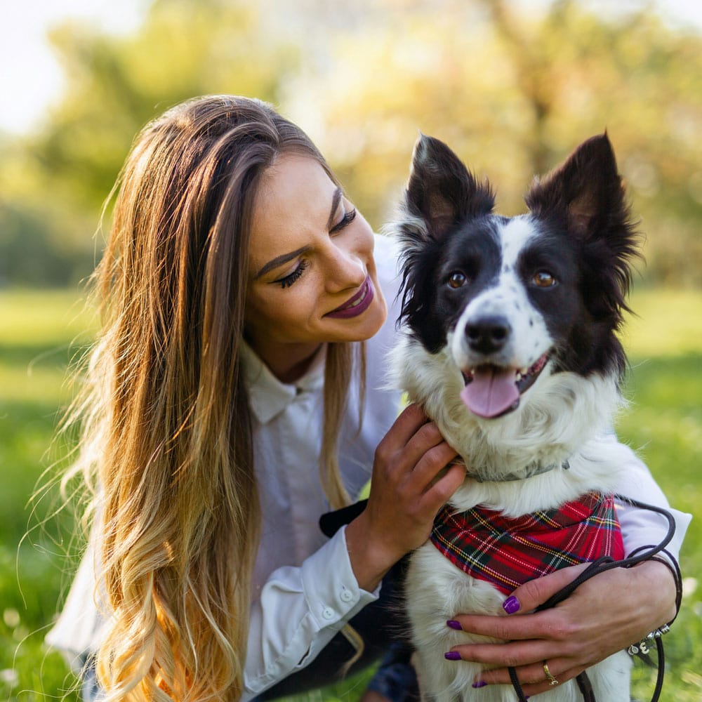 a-woman-and-her-happy-dog-in-nature